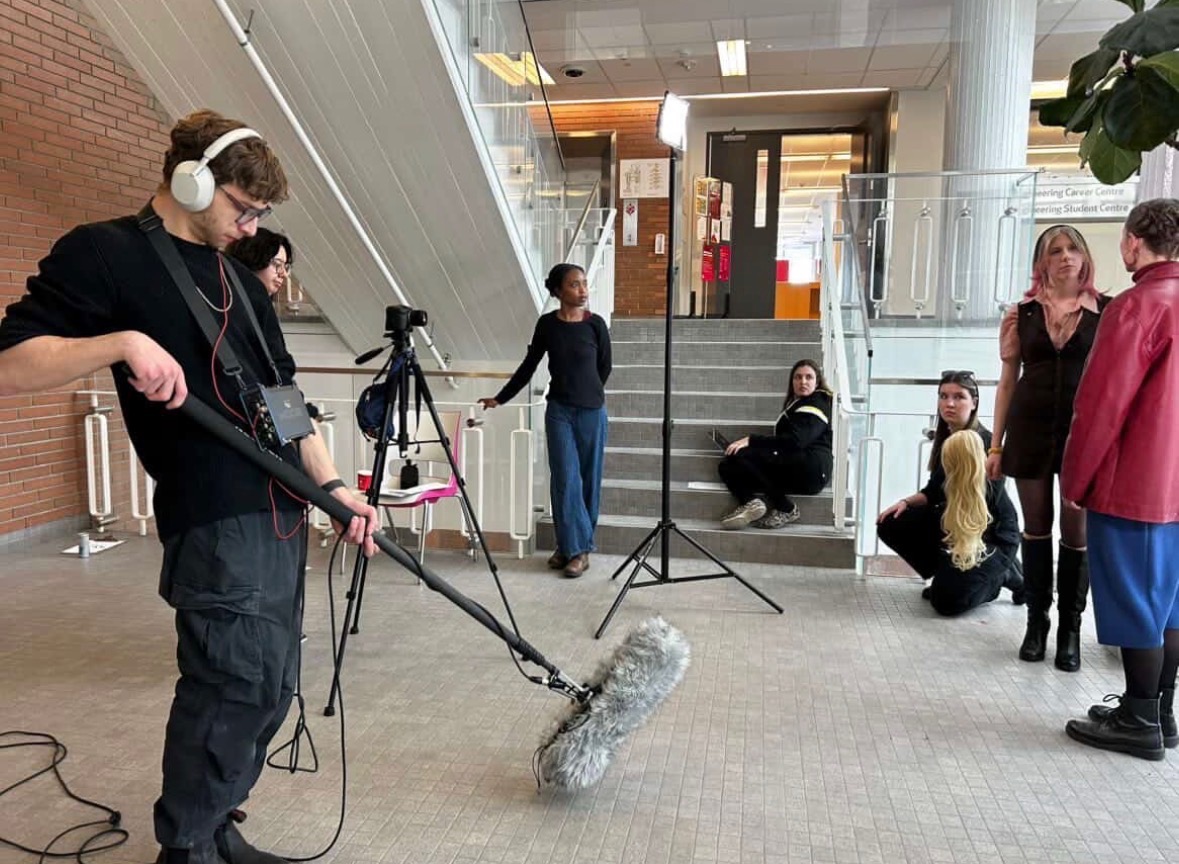 Costa boom operating during a scene setup